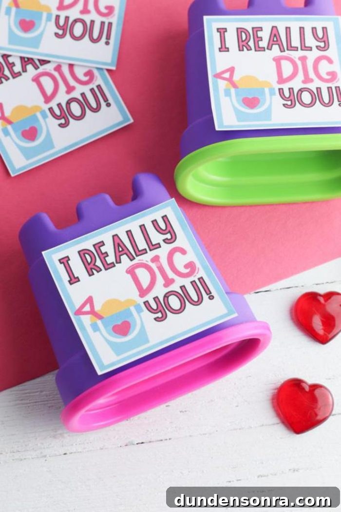 Kinetic sand containers with valentines messages on them. 