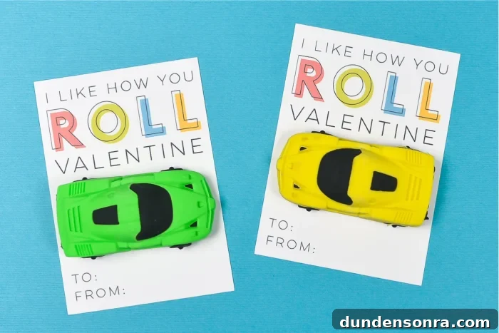 Valentine's messages with toy cars attached on a blue background. 