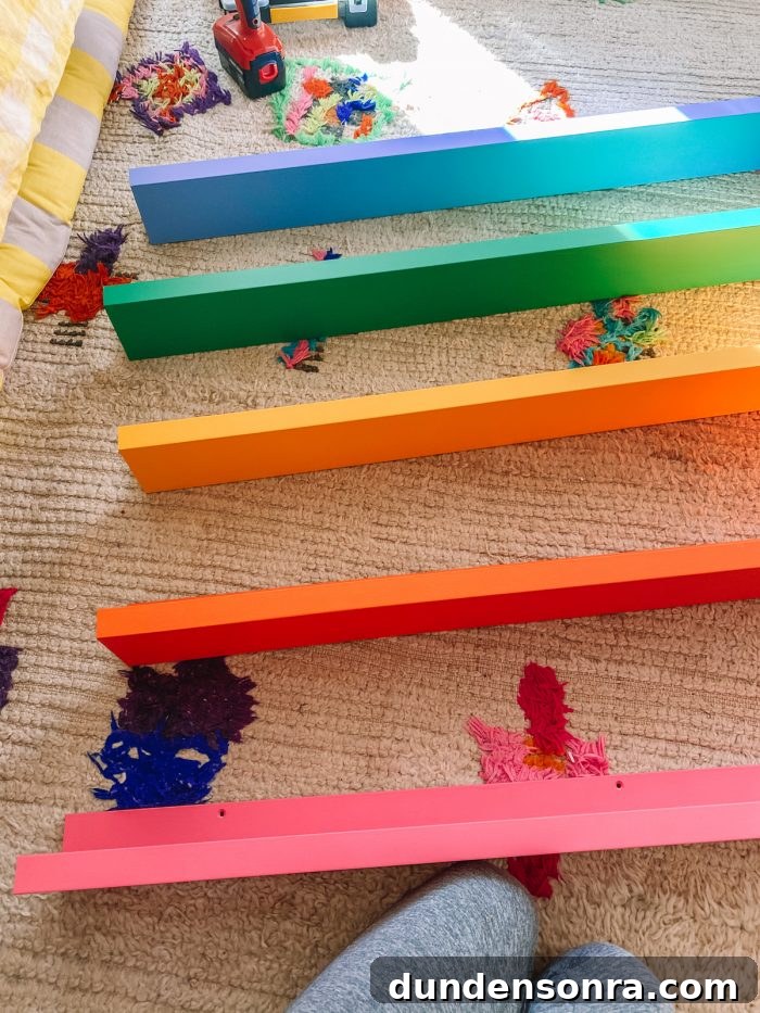 DIY Rainbow Bookshelves: Transform IKEA Shelves with Paint 7 IKEA Photo Ledges Painted in Rainbow Colors