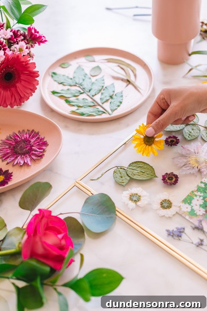 Quick Method to Press Flowers in Under 2 Minutes + DIY Keepsake Frames 11 Flowers on a table about to be pressed