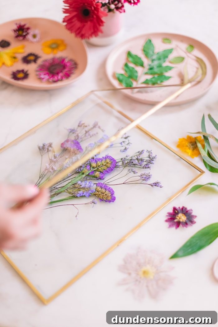 Quick Method to Press Flowers in Under 2 Minutes + DIY Keepsake Frames 14 Pressed purple botanical bouquet in frame