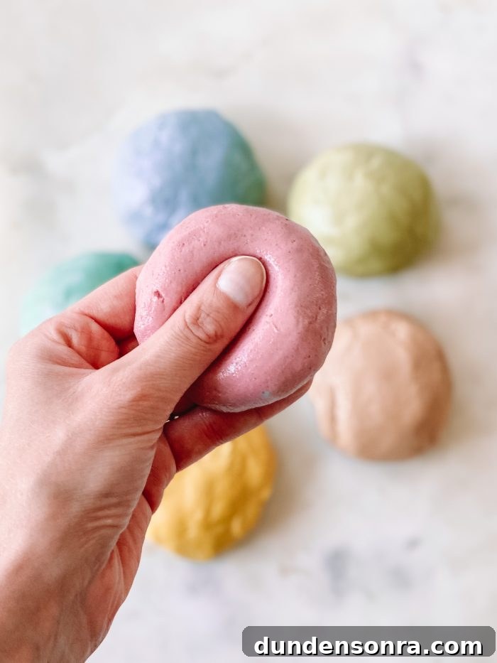 Homemade Play Dough Recipe: No Special Ingredients Needed 3 A close up of a hand holding play dough