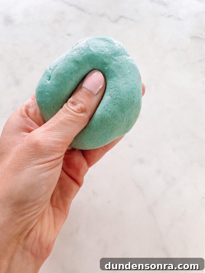 Homemade Play Dough Recipe: No Special Ingredients Needed 5 A close up of a hand holding play dough