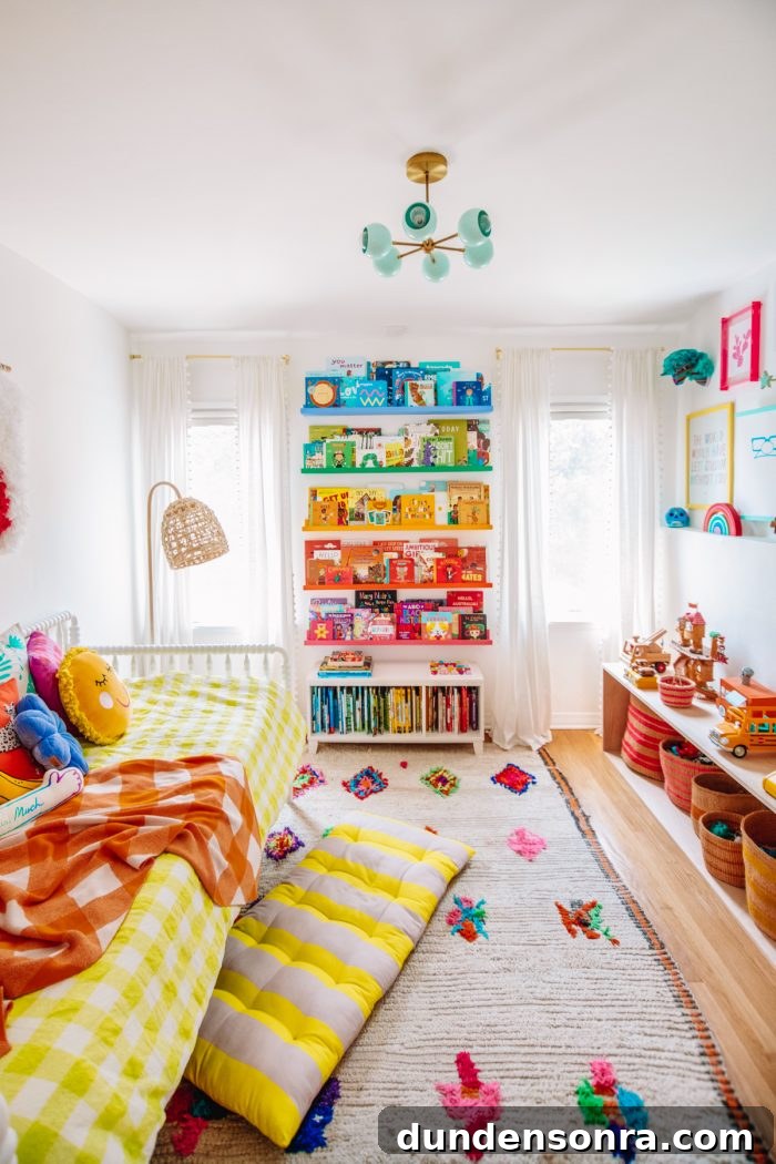 Arlo’s Colorful Big-Kid Bedroom Ideas 2 A bedroom with rainbow bookshelves