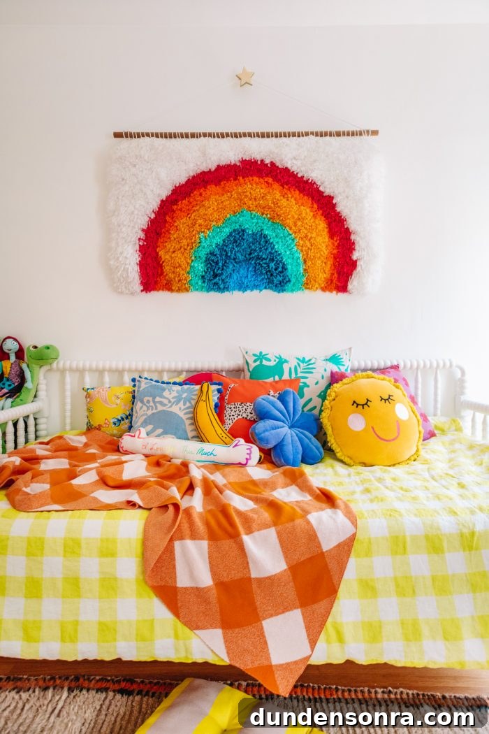 Arlo’s Colorful Big-Kid Bedroom Ideas 4 A bed with a colorful blanket