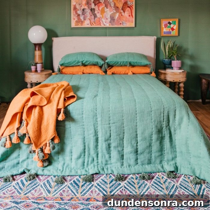 A bed with a colorful blanket