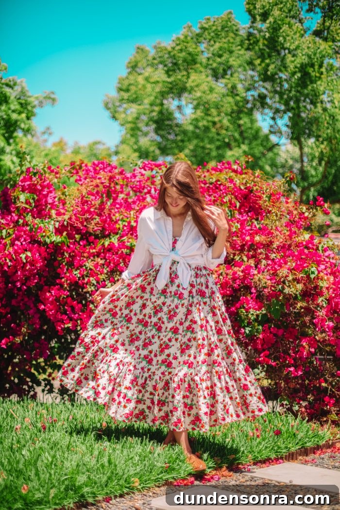A woman standing in front of flowers