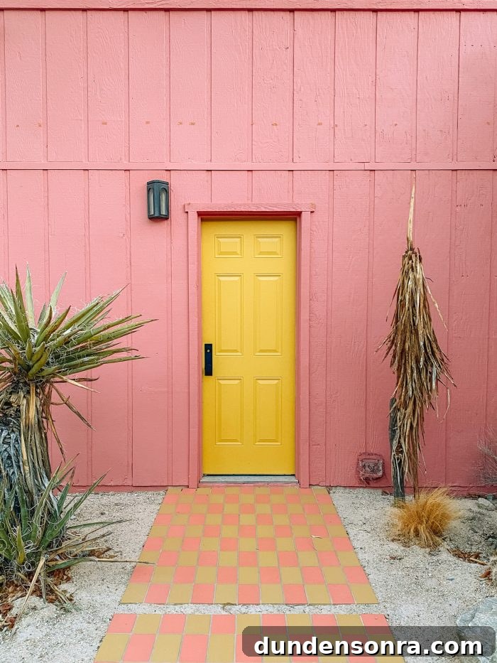 Top Things to See and Do in Joshua Tree & Yucca Valley 3 Pink House with Yellow Door at Oeste in Yucca Valley