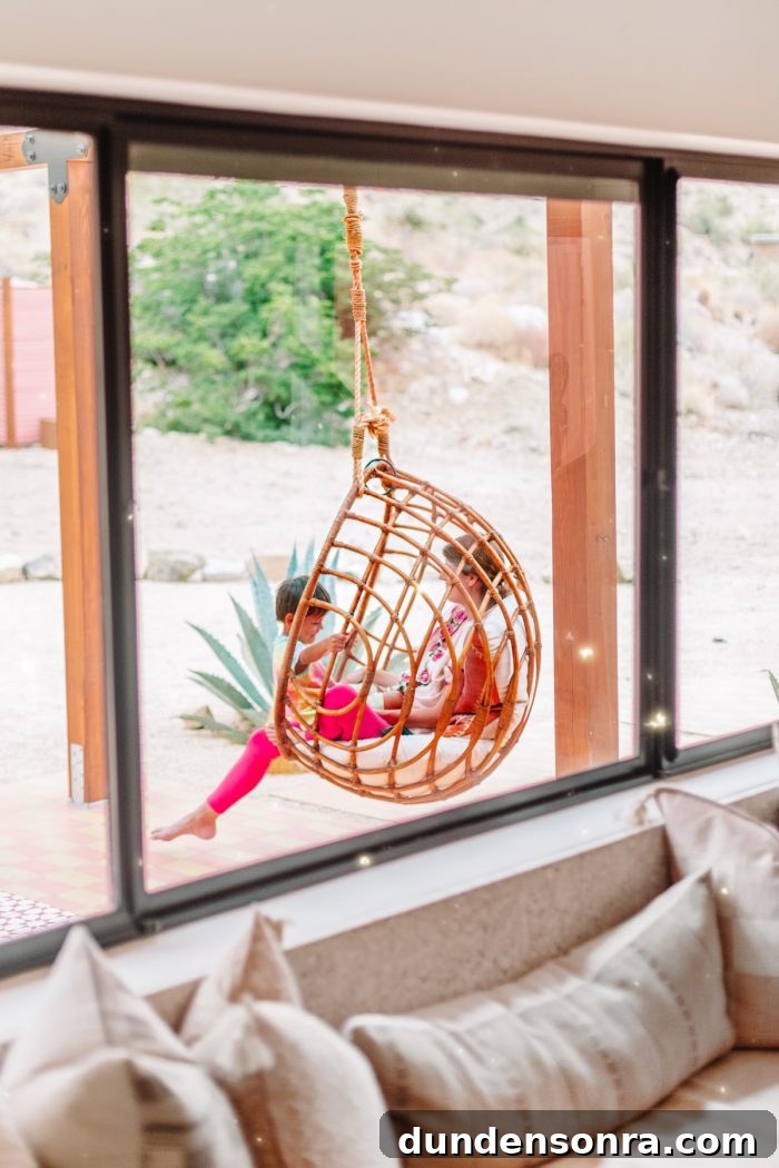 Top Things to See and Do in Joshua Tree & Yucca Valley 22 Hanging rattan chair at Oeste in Yucca Valley