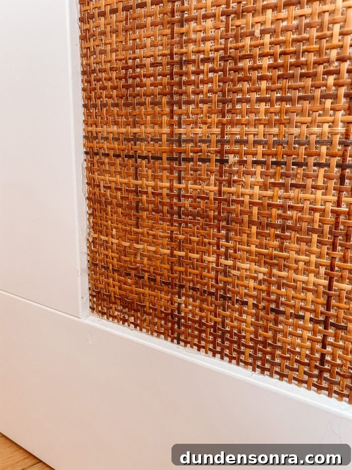 DIY Rattan BRIMNES Daybed: IKEA Hack Guide & Build Tips 13 Rattan webbing on white IKEA Daybed panel