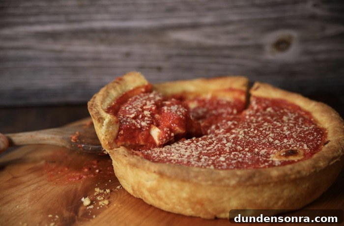 Top Los Angeles Pizzerias: A New Jersey Native’s Picks 7 Hollywood Pies deep dish pizza with a slice being lifted out