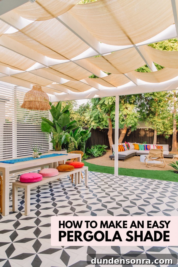 Backyard patio with patterned tile, long table and pergola with shade
