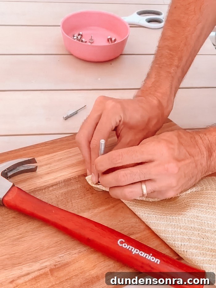 Adding snap with kit to sun shade with hammer in the front