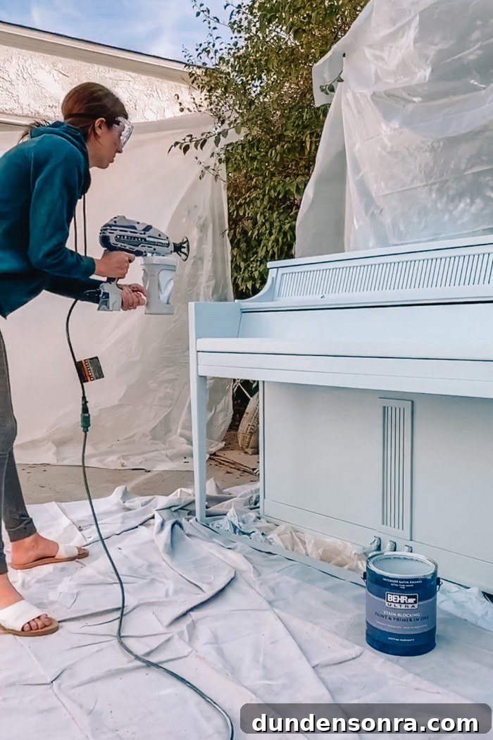Painting a piano with a paint sprayer