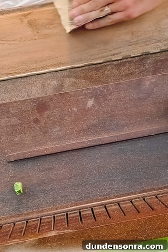 Sanding a wood piano