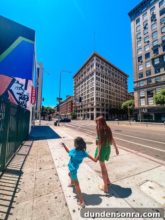 woman and child walking down street in Downtown Los Angeles