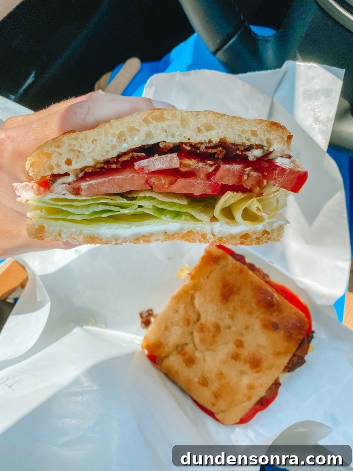 Top Sandwich Spots in Los Angeles: Where Locals Go 2 BLT sandwich on white paper on someone's lap