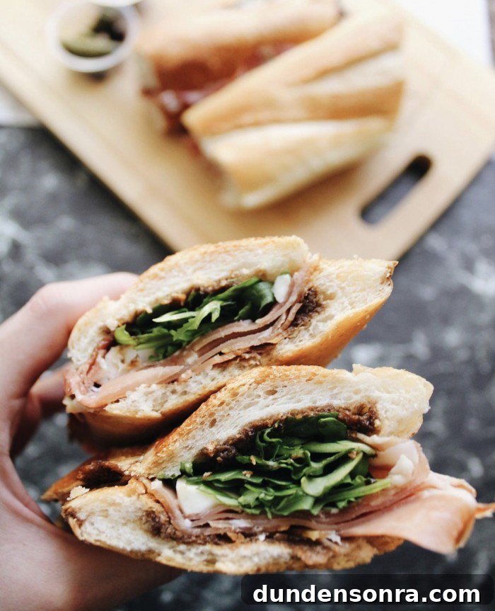 Top Sandwich Spots in Los Angeles: Where Locals Go 5 Larchmont Wine and Cheese Proscuitto Sandwich held about a table