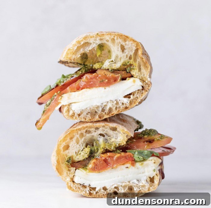 Top Sandwich Spots in Los Angeles: Where Locals Go 9 Caprese sandwich stacked on a white background