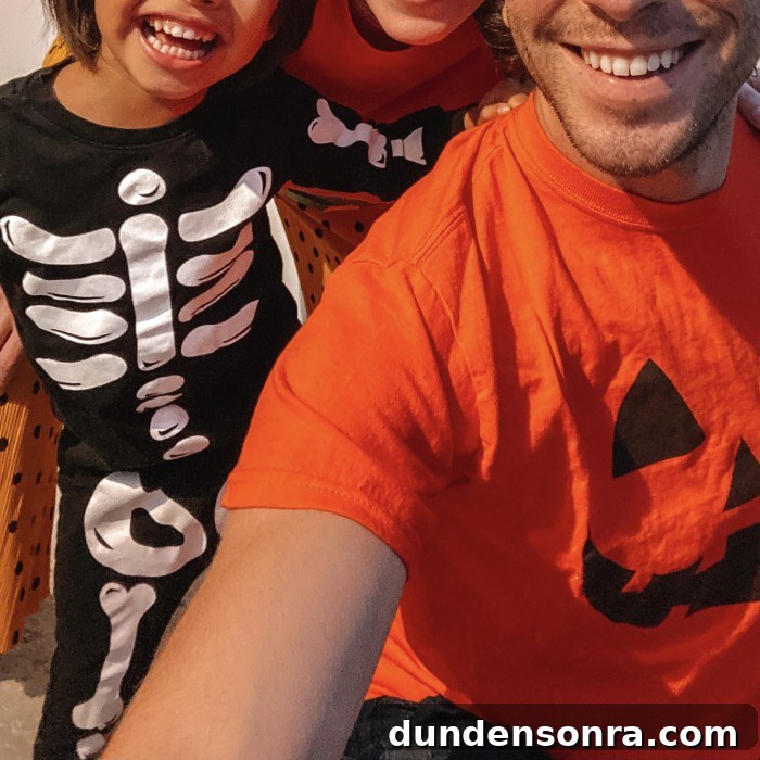 Adorable Halloween Pajamas for Kids: Cute Styles & Cozy Fits 3 Kid in Halloween Skeleton Pajamas and Dad in Jack-o-Lantern Shirt