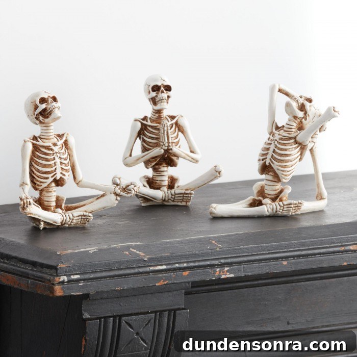 Top Halloween Home Decor Ideas to Transform Your Space 11 Yoga Skeletons on black mantle