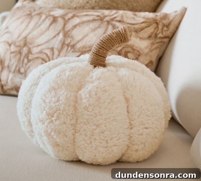 Top Halloween Home Decor Ideas to Transform Your Space 17 plush white pumpkin pillow on white couch
