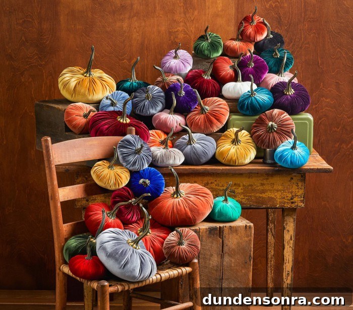 Top Halloween Home Decor Ideas to Transform Your Space 4 velvet pumpkins in rainbow colors on table and chair