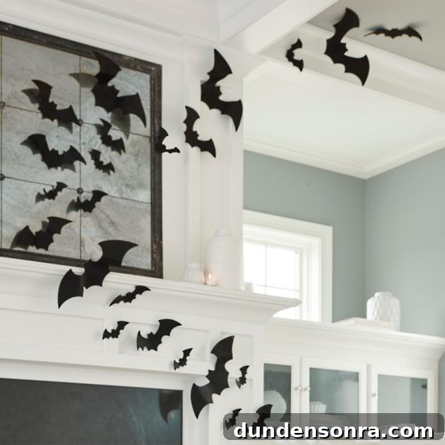 Top Halloween Home Decor Ideas to Transform Your Space 32 Felt bats on a white mantle and ceiling in a living room