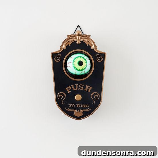 Top Halloween Home Decor Ideas to Transform Your Space 33 Eyeball Doorbell on a White Wall