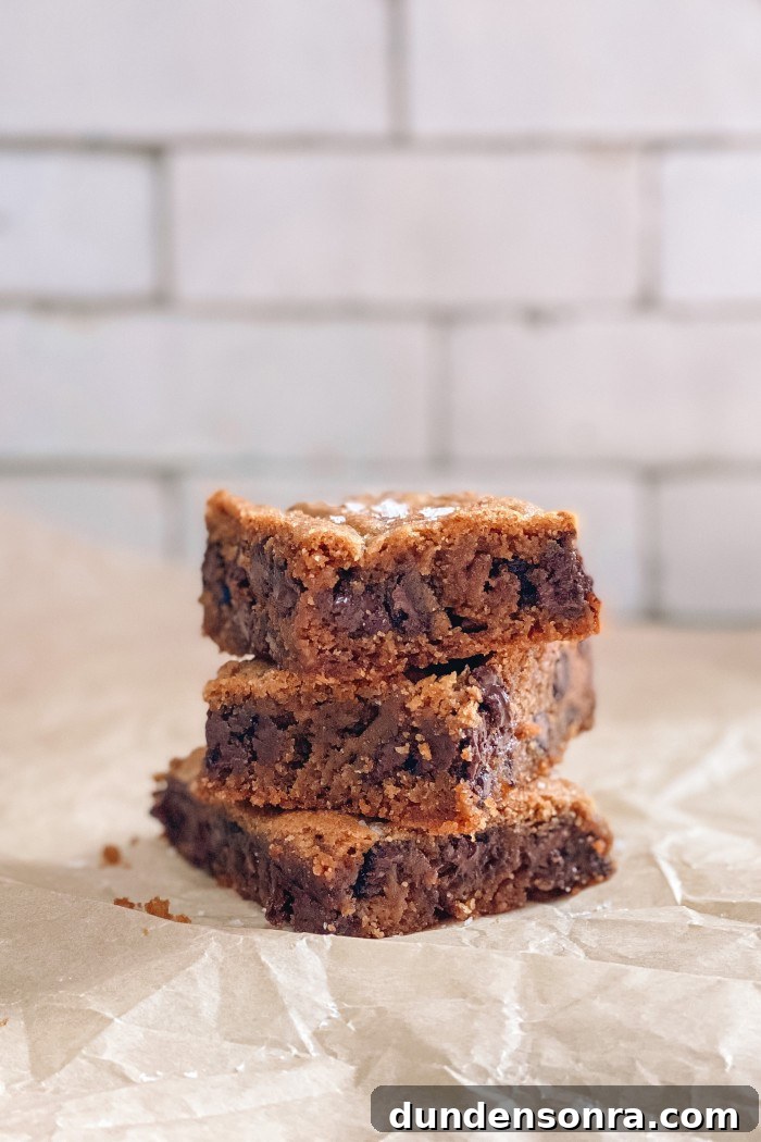 Chewy Chocolate Chip Cookie Bars Recipe for Perfect Snacks 5 chocolate chip cookie bars stacked on parchment paper