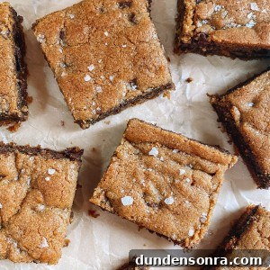 Chewy Chocolate Chip Cookie Bars Recipe for Perfect Snacks 10 chocolate chip cookie bars on parchment paper with flaked salt on top