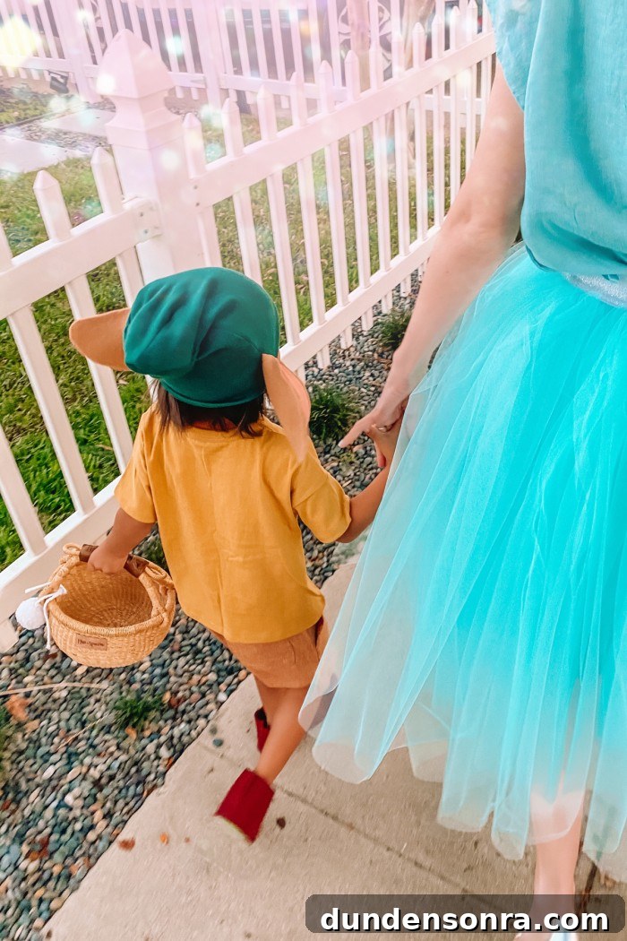 DIY Cinderella Family Costume Ideas for Matching Group Outfits 13 Child in Gus Gus Halloween costume and mom in cinderella costume walking