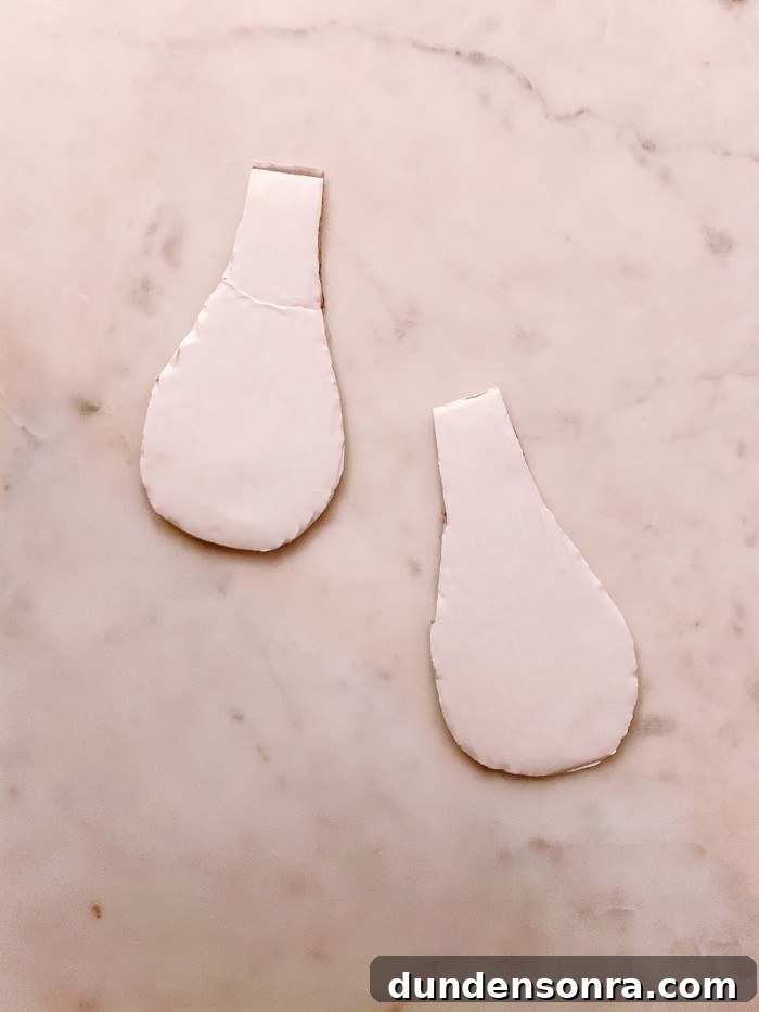 DIY Cinderella Family Costume Ideas for Matching Group Outfits 6 white cardboard epaulettes on marble table