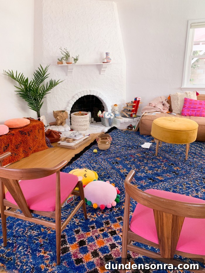 Messy living room with blue rug and pink dining chairs