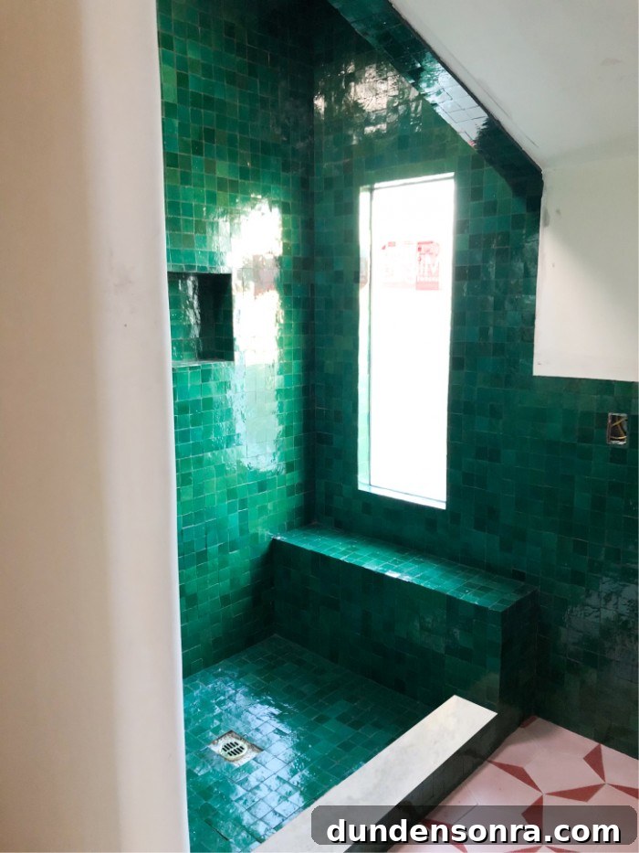 Green zellige tile shower with marble 