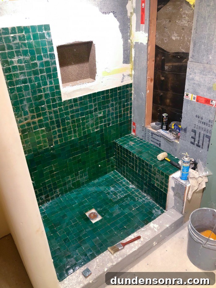 Under construction green zellige tile shower