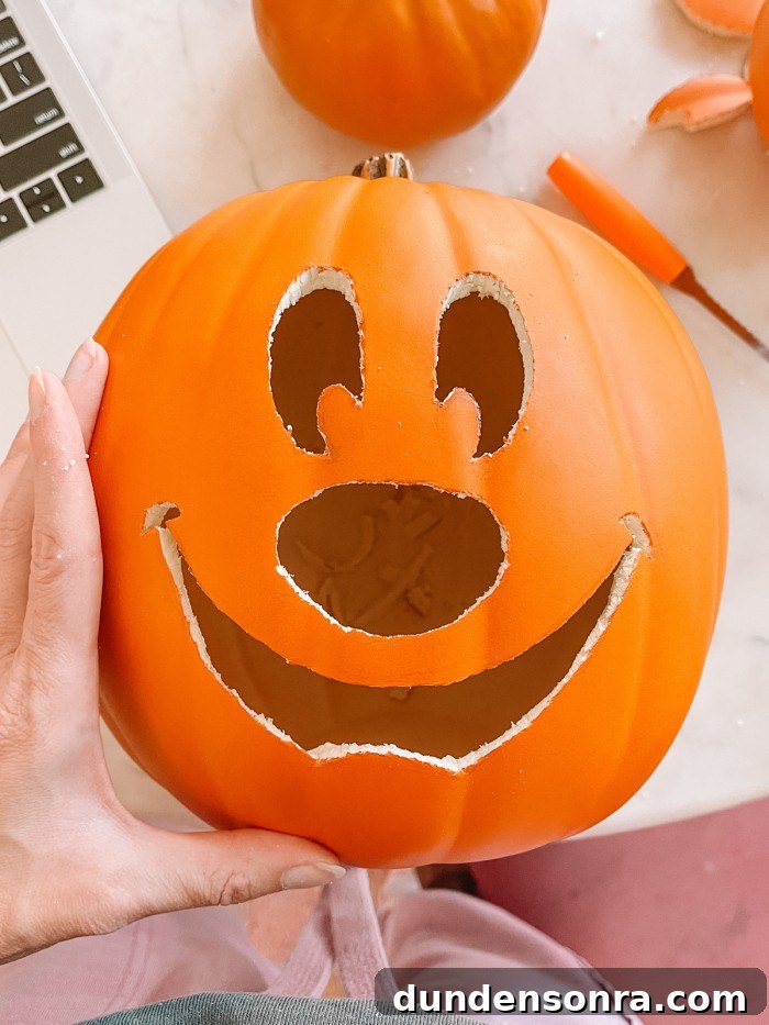 Mickey Mouse Pumpkin Carving and Decorating Guide 7 pumpkin with mickey face carved