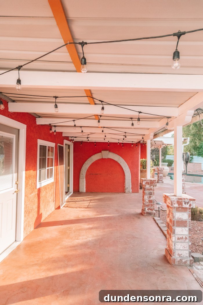 Outdoor pergola with red wall