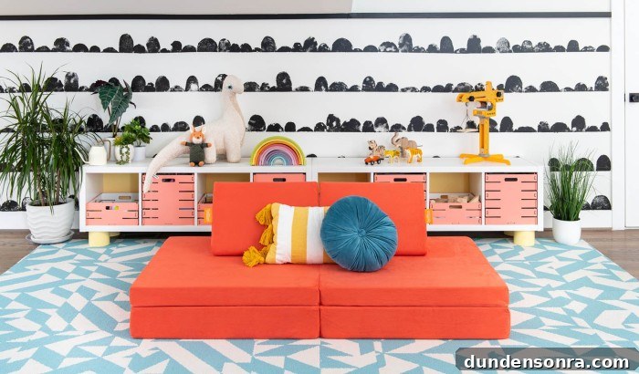 Coral nugget play couch in front of black and white wall