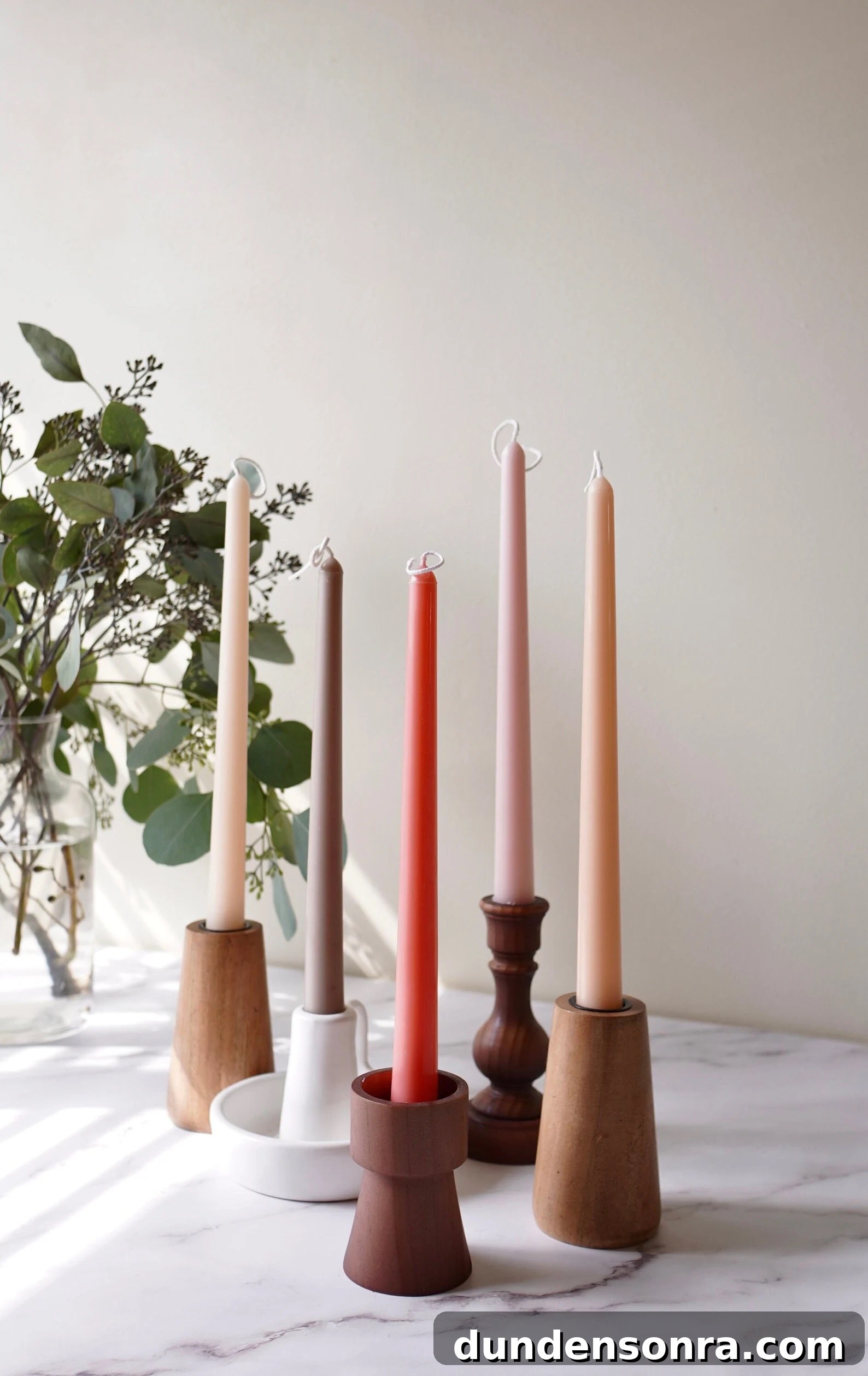 taper candles in wood candle sticks