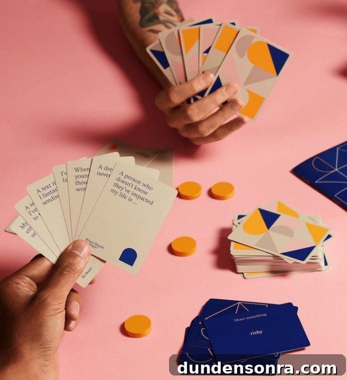 People playing "where should we begin game." Cards have prompts for players to answer. 