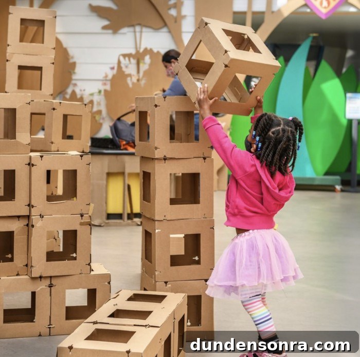 Girl stacking large blocks