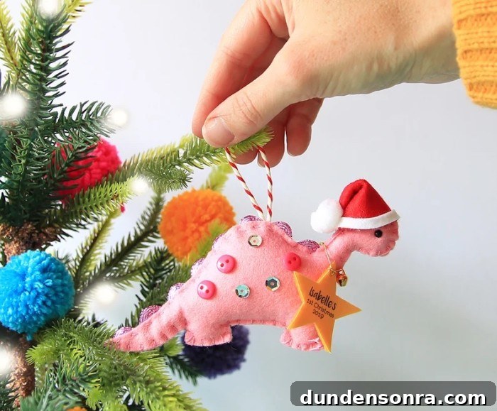pink dinosaur baby's first christmas ornament