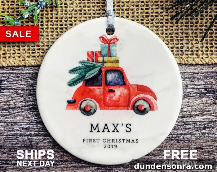 baby's first christmas ornament with illustrated car