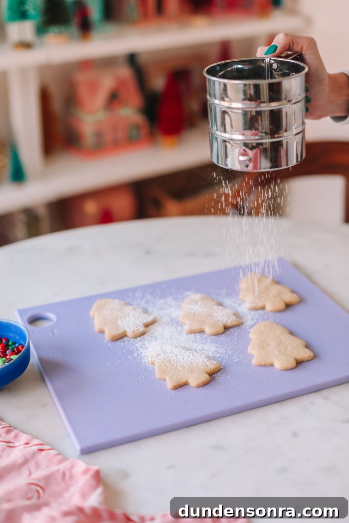 Zesty Lemon Shortbread Cookies Recipe for Melt-in-Your-Mouth Treats 5 Cookies being dusted with powdered sugar