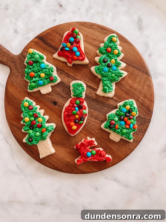 Zesty Lemon Shortbread Cookies Recipe for Melt-in-Your-Mouth Treats 6 Decorated Christmas cookies on a wood cutting board