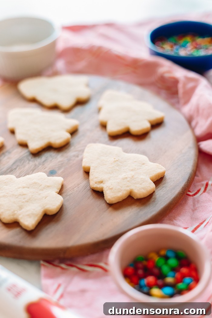 Zesty Lemon Shortbread Cookies Recipe for Melt-in-Your-Mouth Treats 7 Cookies on a wood cutting board with m&ms in a bowl in front