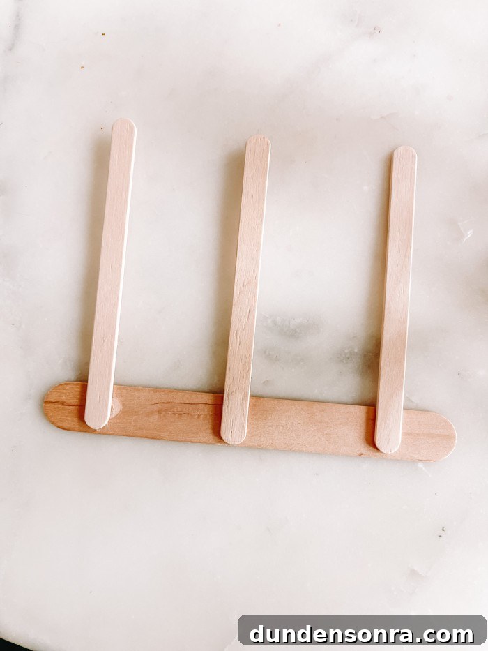 Christmas Window Popsicle Stick Ornament Craft Ideas 4 Popsicle sticks glued together on marble table