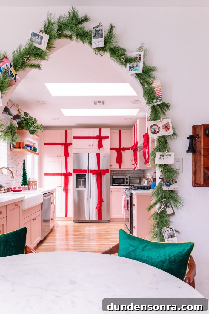 Creative Ways to Display Christmas Cards This Holiday Season 11 Christmas cards clipped to garland around arch