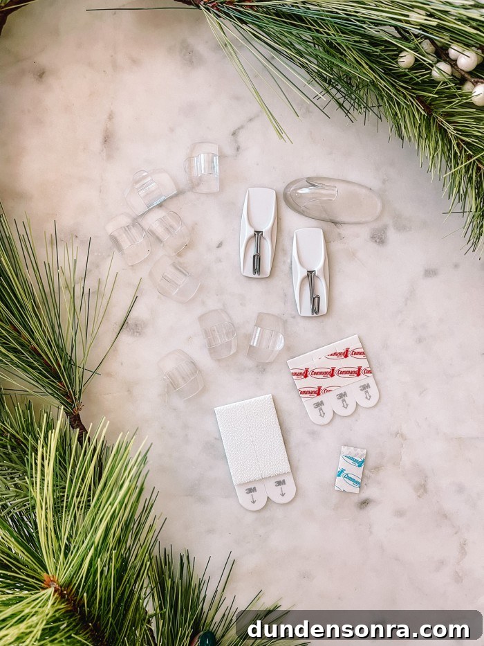 Creative Ways to Display Christmas Cards This Holiday Season 4 command hooks on marble table with garland